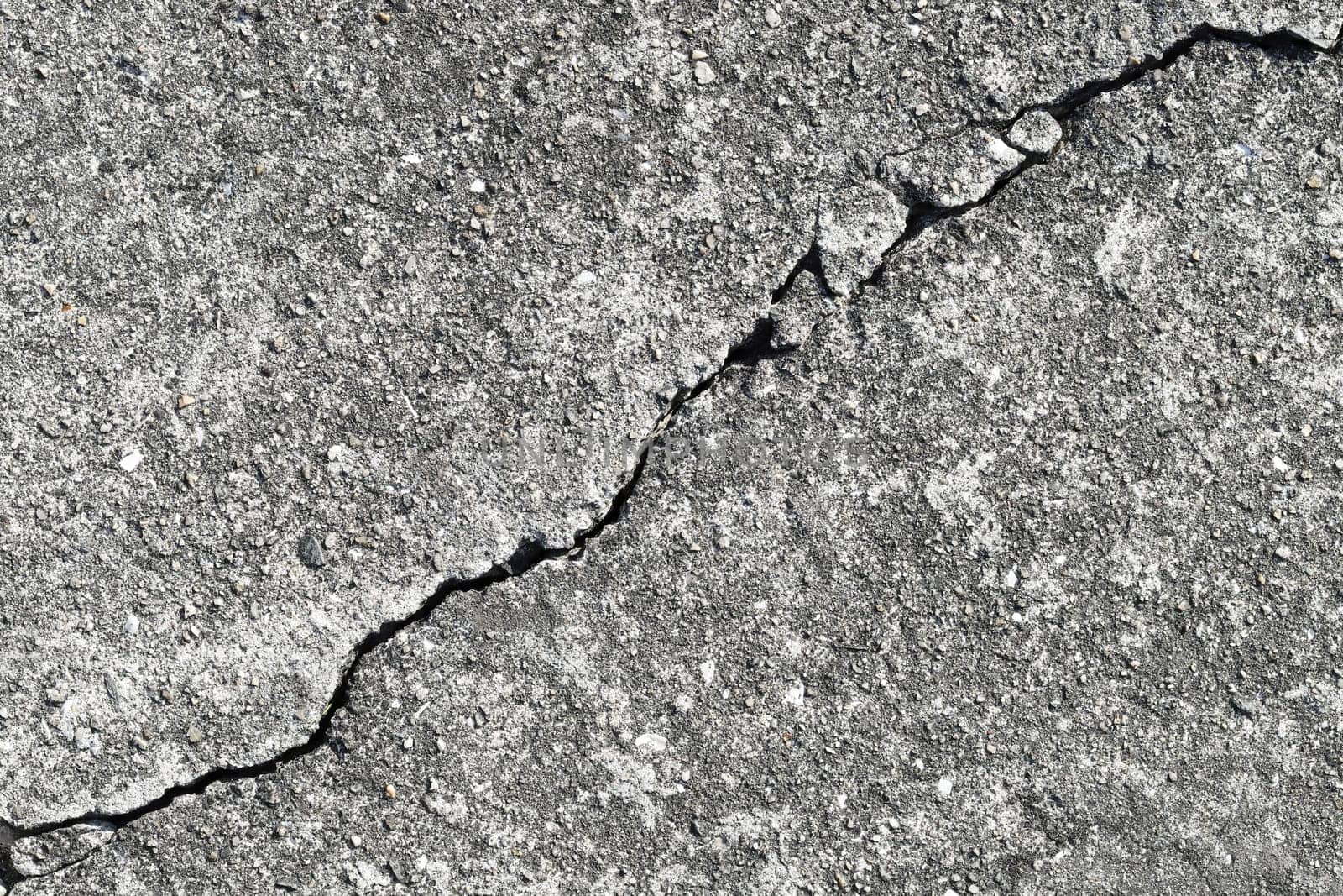 Gray cracked building wall texture for background, copy space