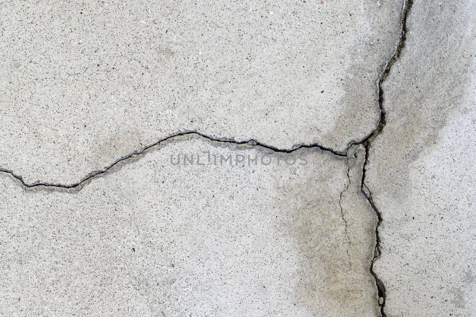 Gray cracked building wall texture for background, copy space