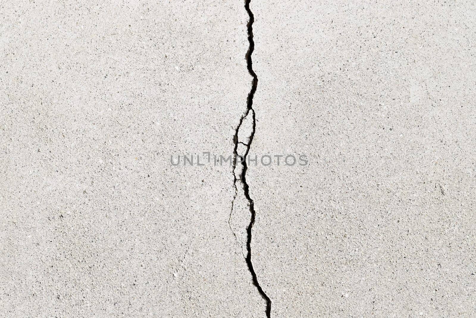 Gray cracked building wall texture for background, copy space