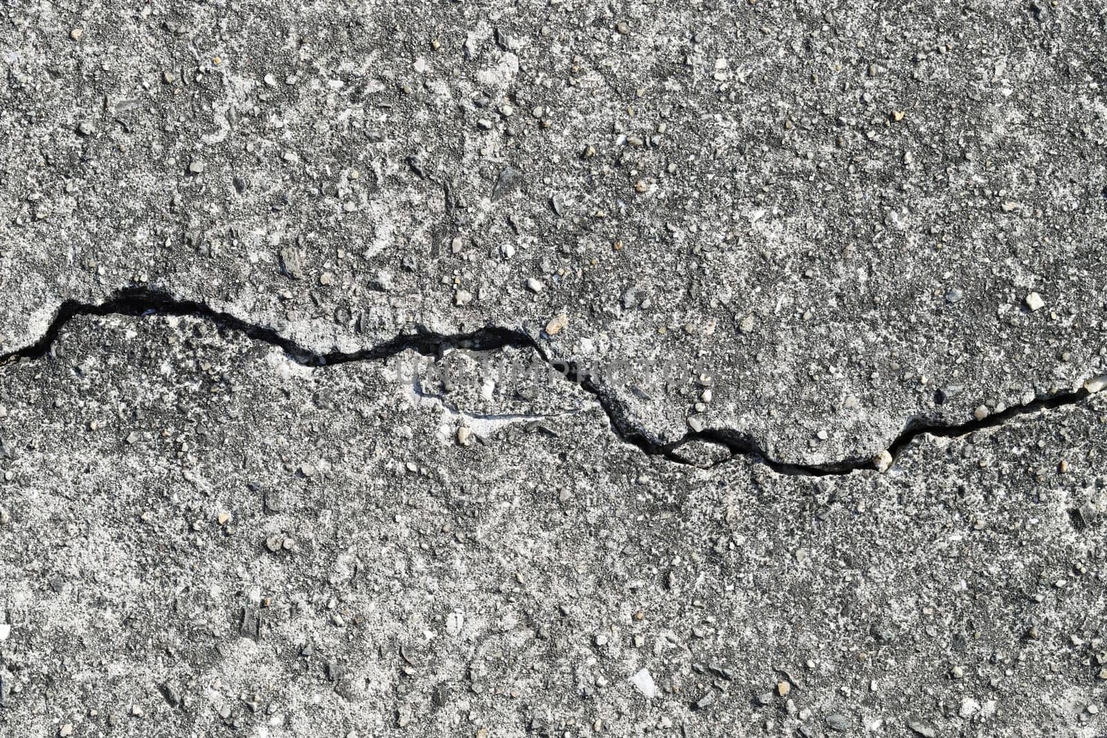 Gray cracked building wall texture for background, copy space