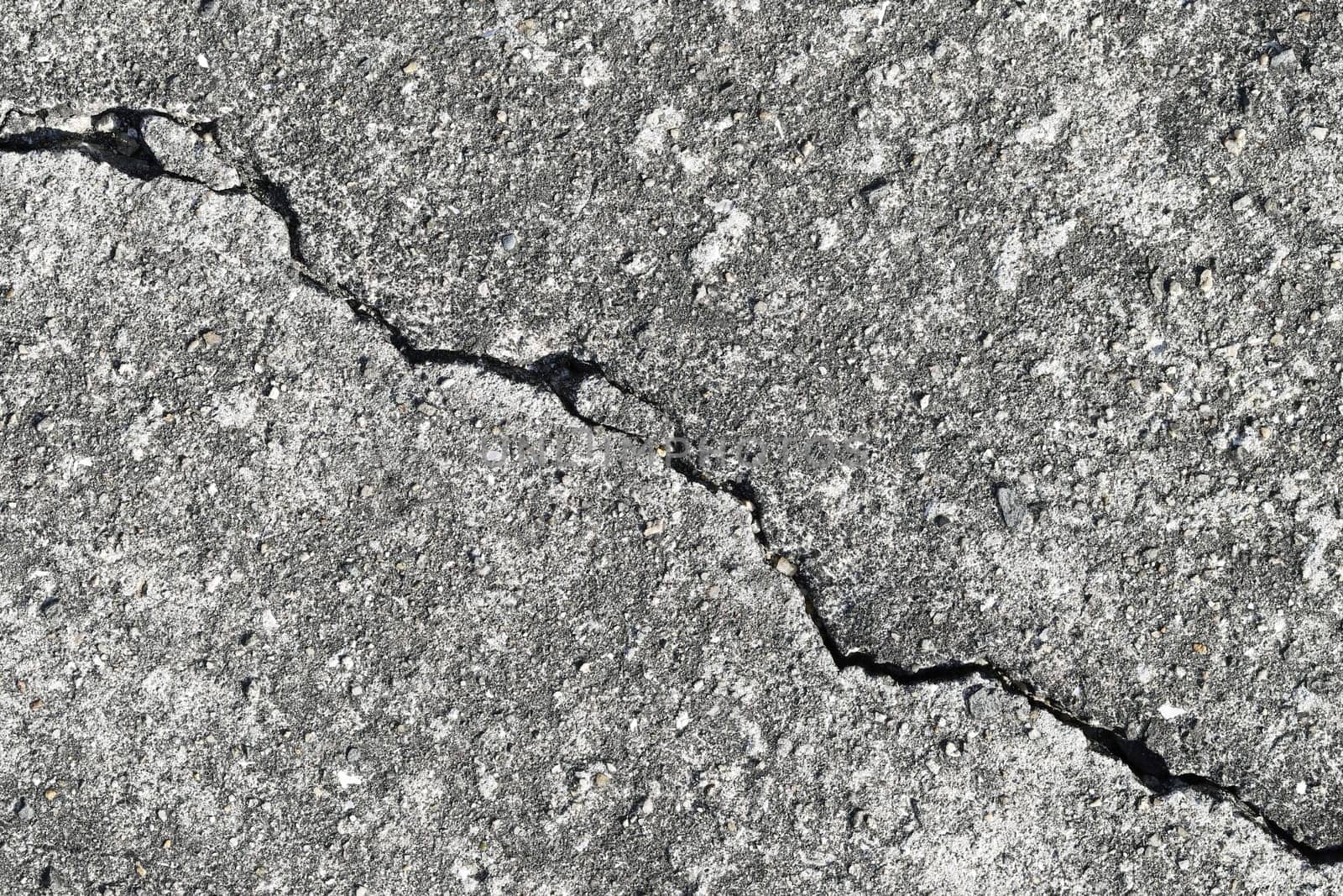 Gray cracked building wall texture for background, copy space