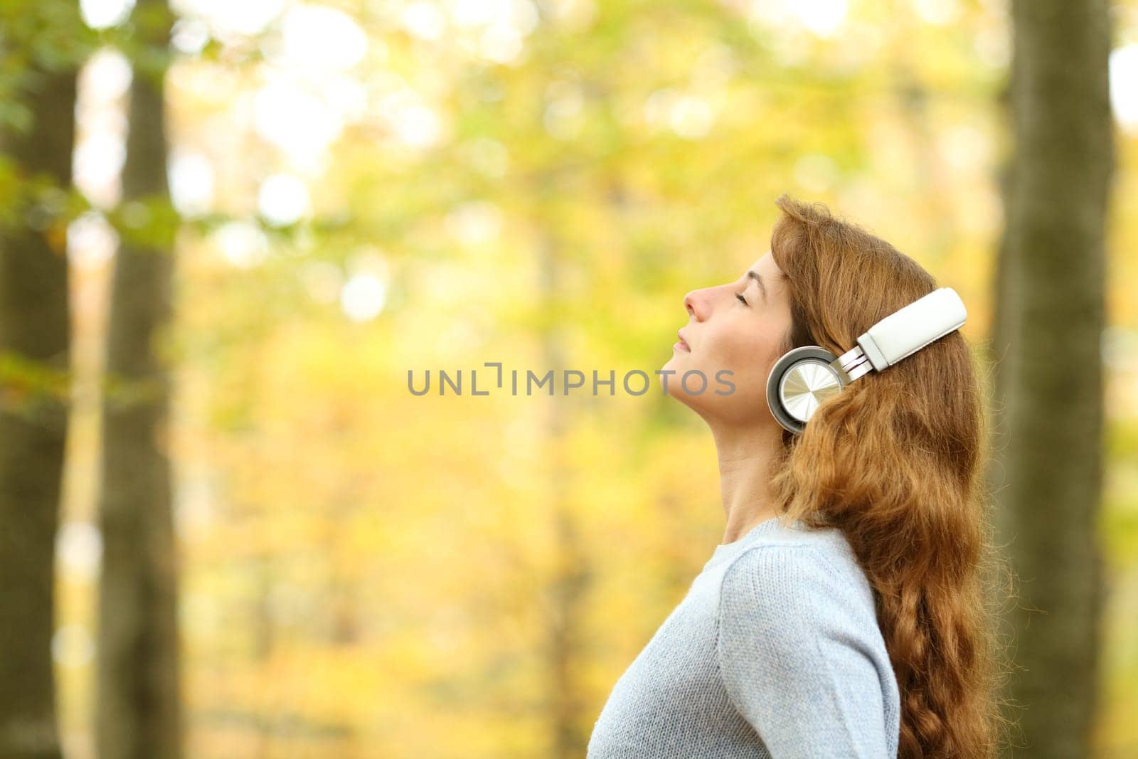 Female breathing fresh air wearing headphones