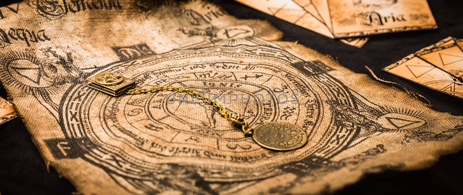 Ancient esoteric witchcraft background. Occultims and paganism old symbol, with mysterious runes and alphabet.