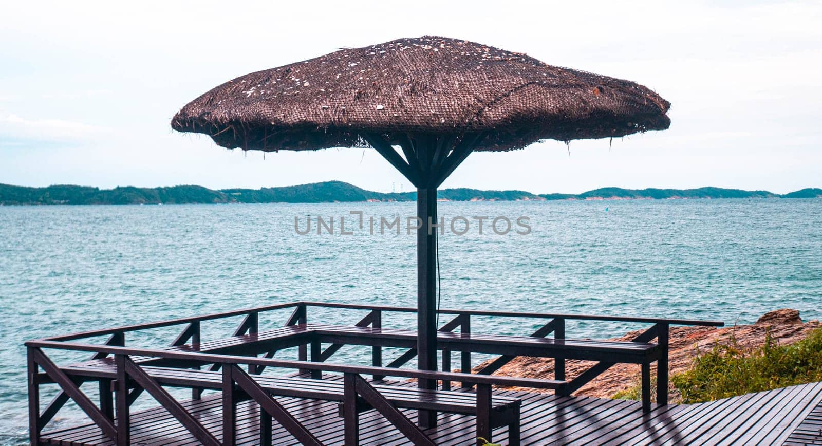 Reed beach umbrella on the background of the sea and a clear sky in Khao Laem Ya-Mu Ko Samet National Park Rayong Thailand