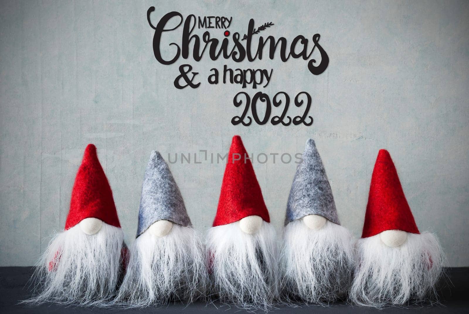 Five Santa Claus With Hat. Concrete Background With English Calligraphy Merry Christmas And A Happy 2022