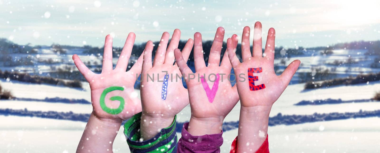 Children Hands Building Colorful Word Give. Snowy Winter Background With Snowflakes