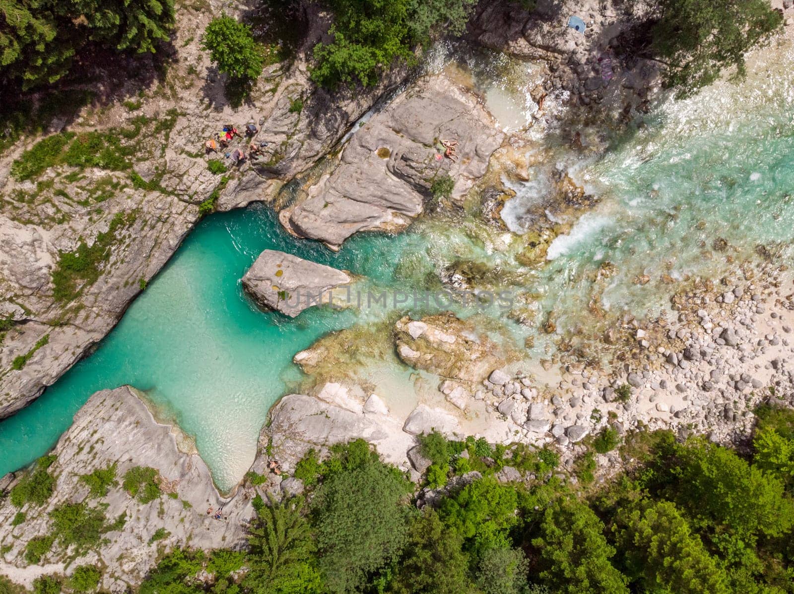 Aerial drone view of magical turquoise color of Soca river, Slovenia.