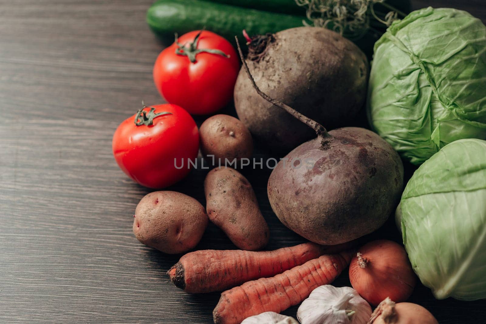 Fresh and Bright Vegetables Lie on the Kitchen Table.