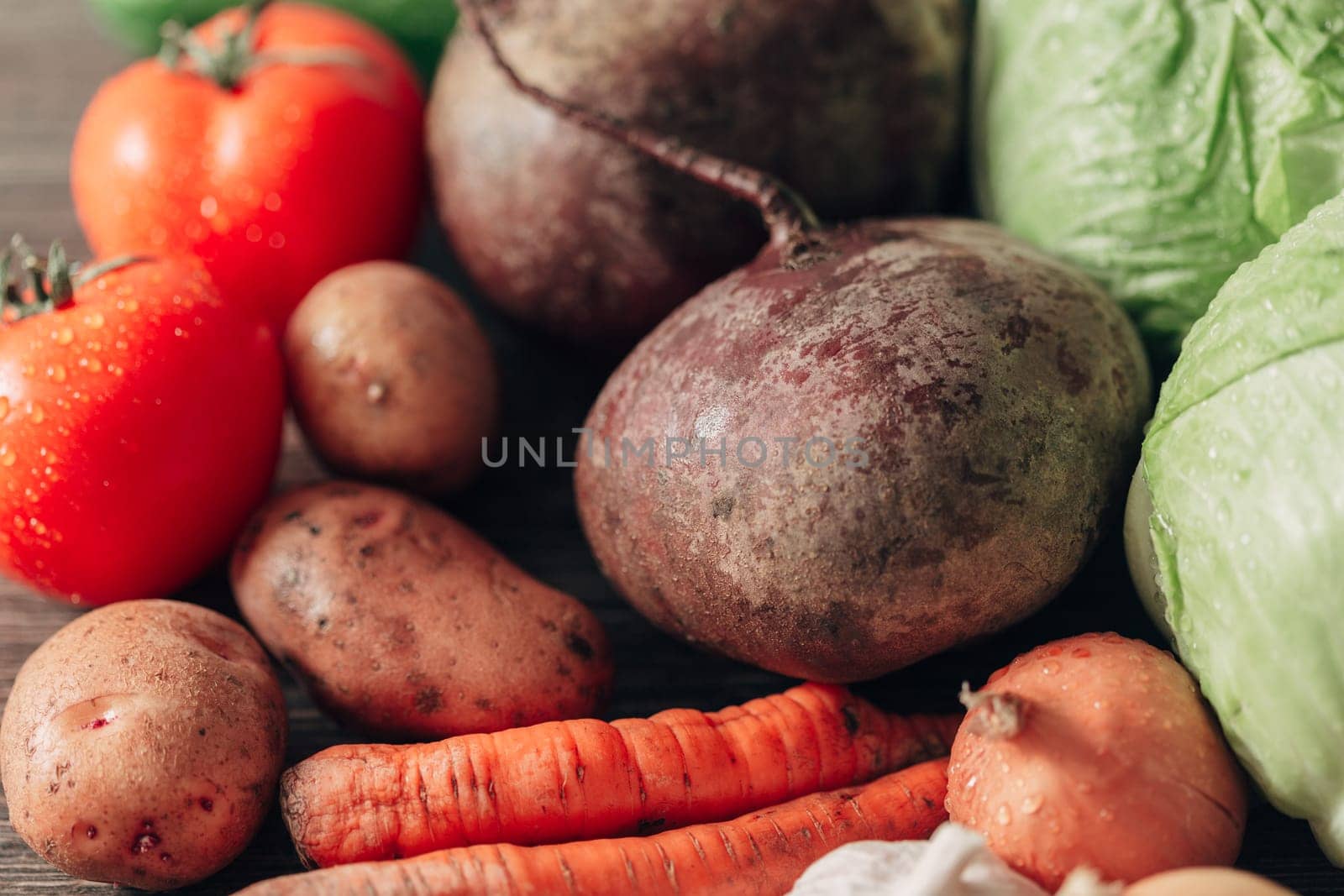Fresh and Bright Vegetables Lie on the Kitchen Table.