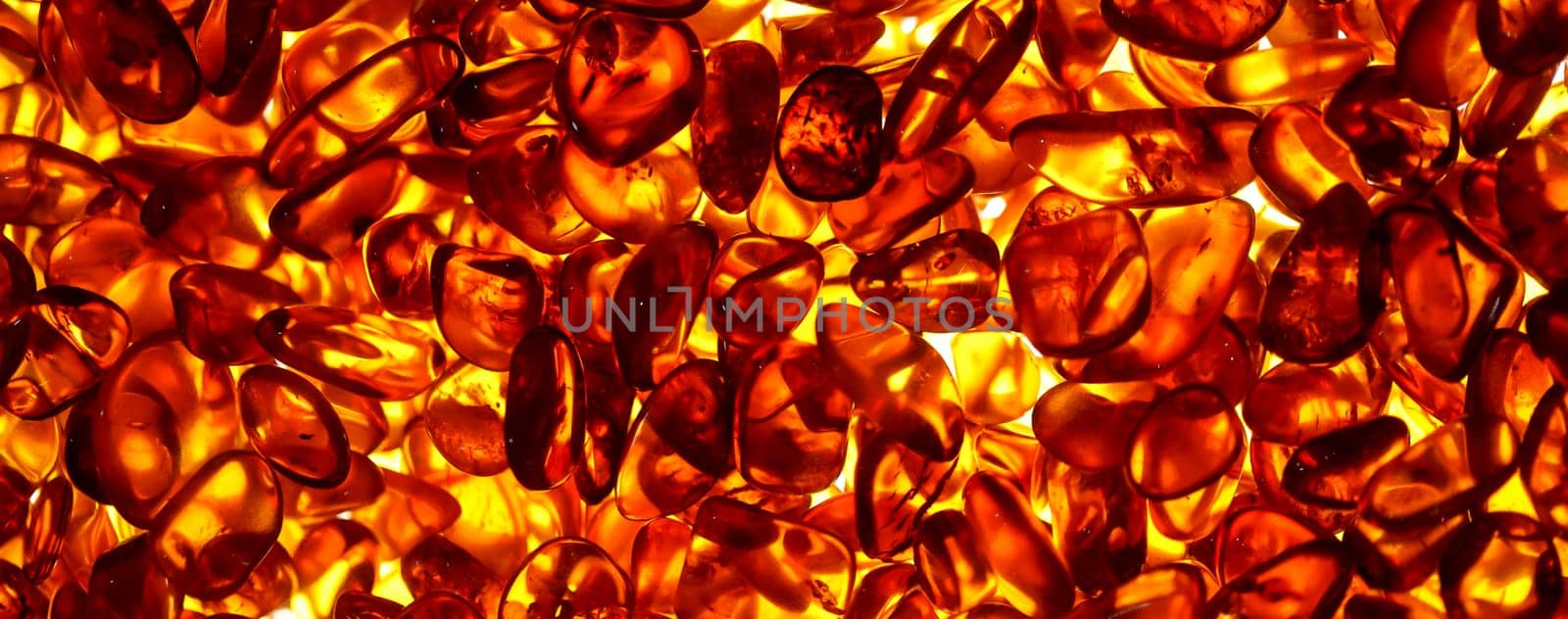 Amber in the light. Polished amber. Amber is also used extensively in jewelry.