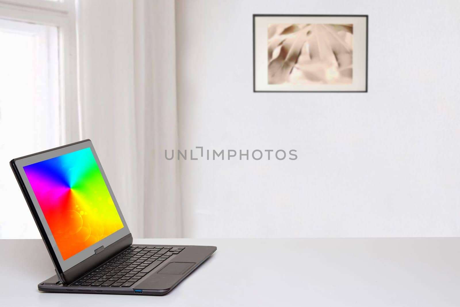 Table top on computer background. Modern portable Laptop with abstract blurred screen on white table over abstract blurred home office background with copy space for text phrases and product montage.
