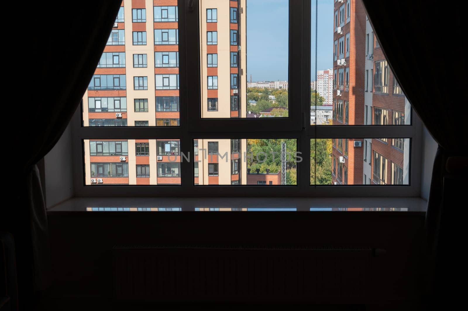 View from room with big window in modern new neighborhood
