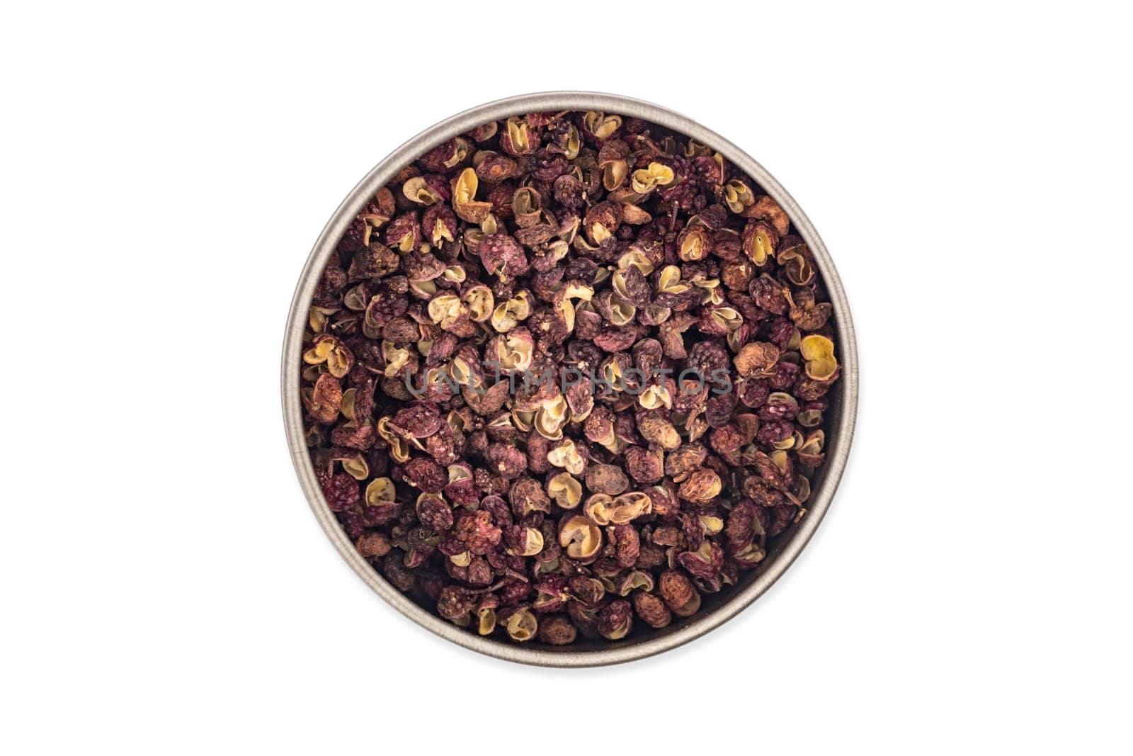 Szechuan pepper in a bowl isolated over white background