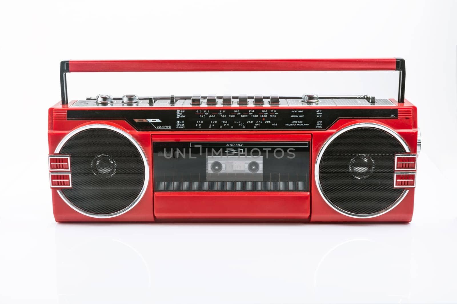 Red vintage Tape player isolated on white background
