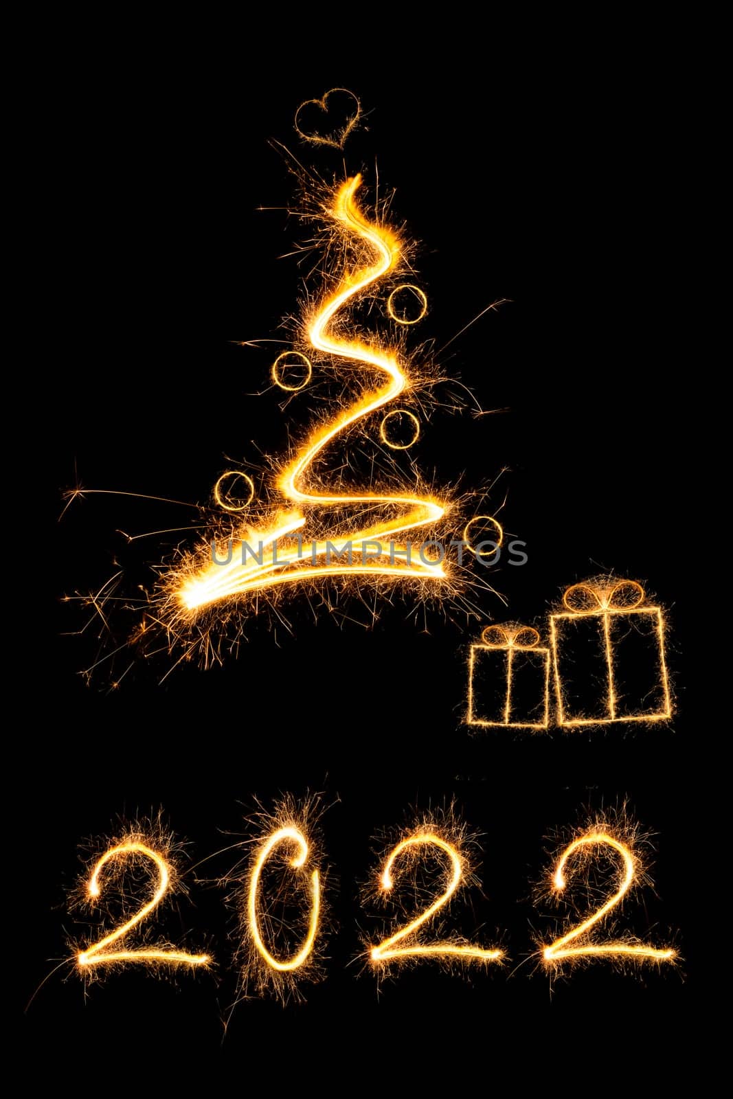 Merry christmas greeting card. Sparkling firework christmas tree with presents and number 2022.