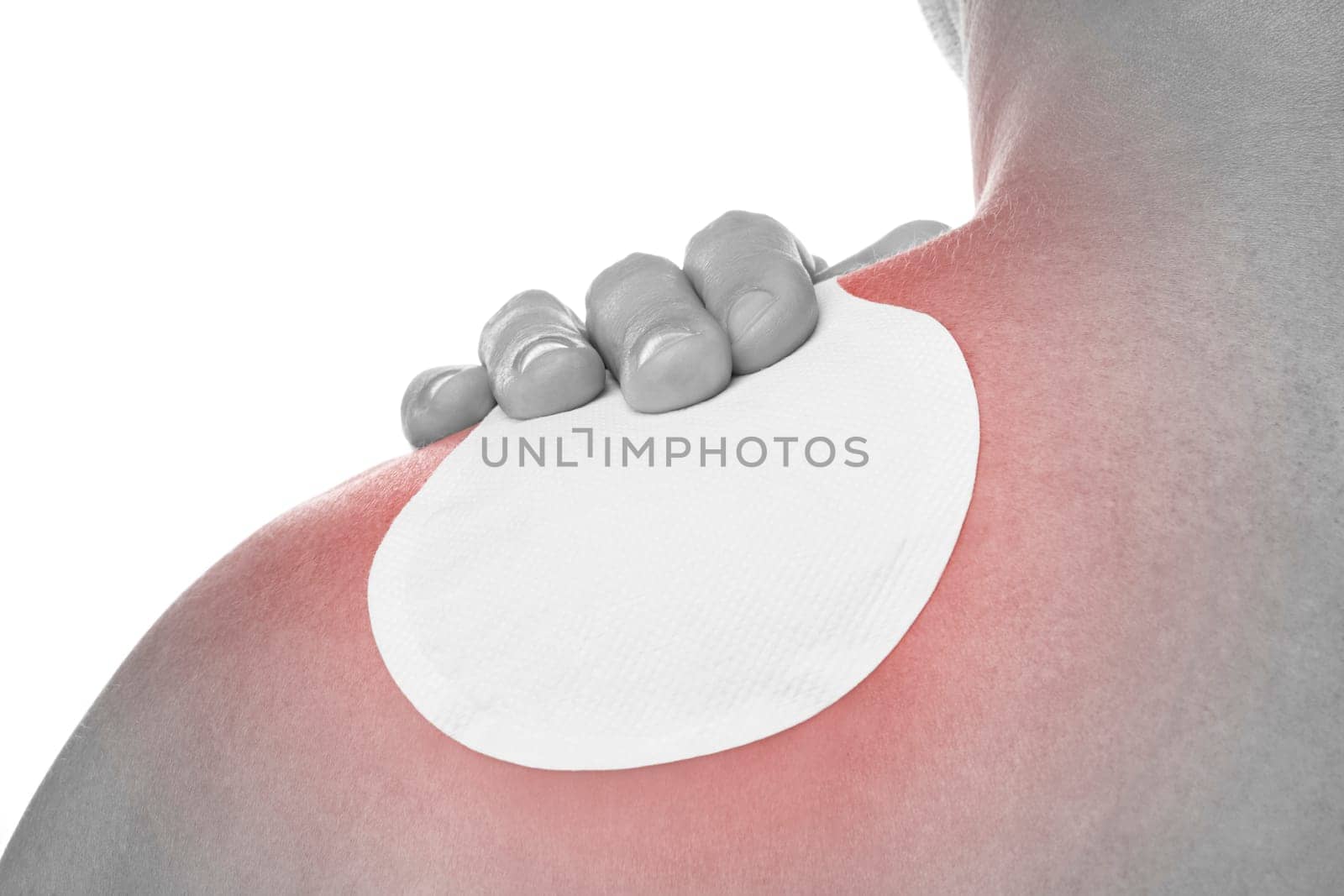 Medical patch therapy for pain relief with an occupational disease syndrome of a young man with shoulder pain. Health problems from overwork.