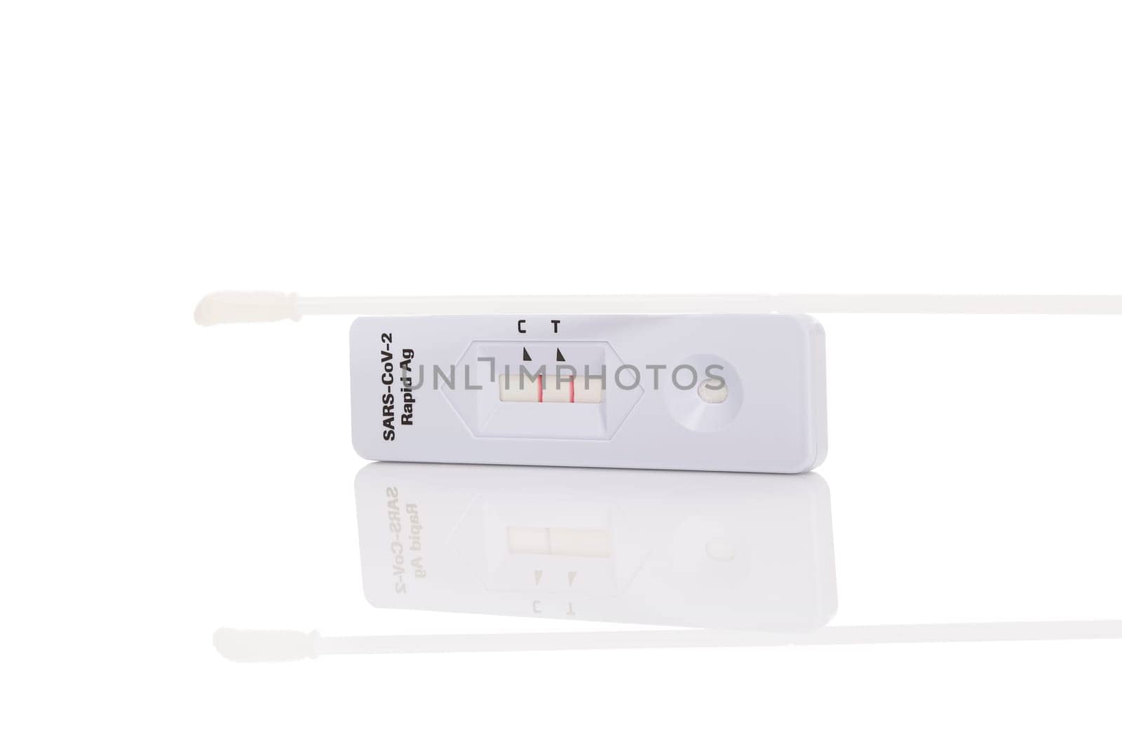 Positive result in rapid Ag Covid test isolated on white background.