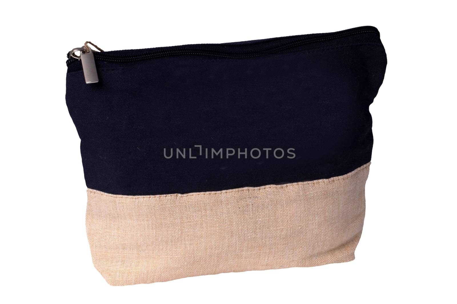 Cosmetic bags. Close-up of a beautiful black and beige cosmetic bag with a brown tag isolated on a white background. Macro. Used for essential equipment brushes for make-up and cosmetic products.
