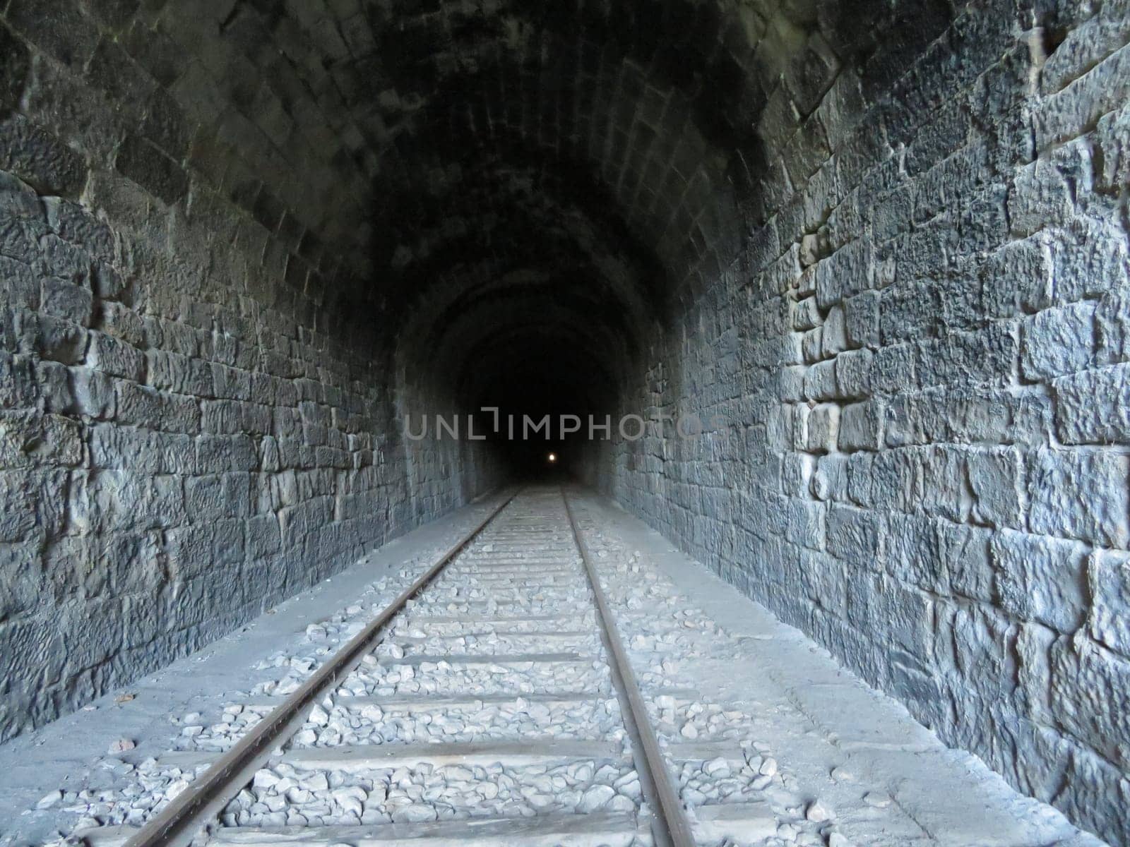 iron road bridges metal rail light at the end of the tunnel train transport