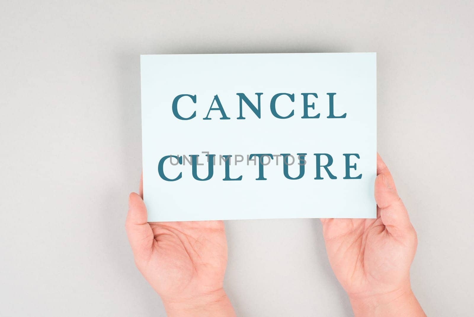 The words cancel culture are standing on a paper, thought control, censorship of free speech