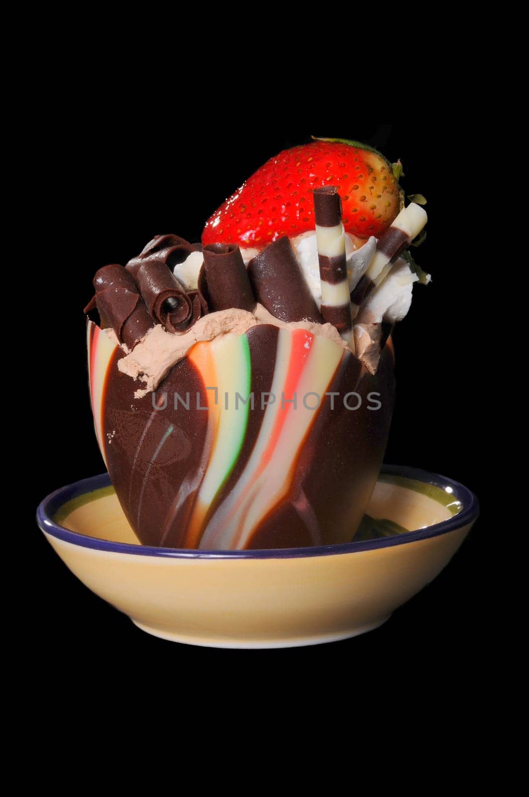 Frozen ice cream parfait and chocolate delight with strawberry isolated over black