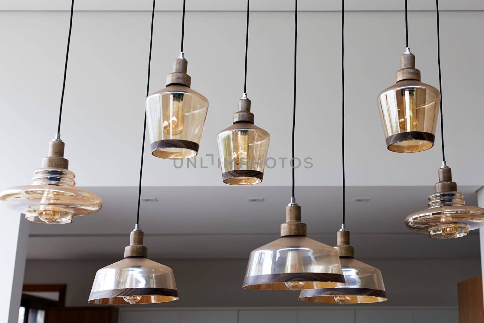 shiny glass chandeliers hanging from the ceiling