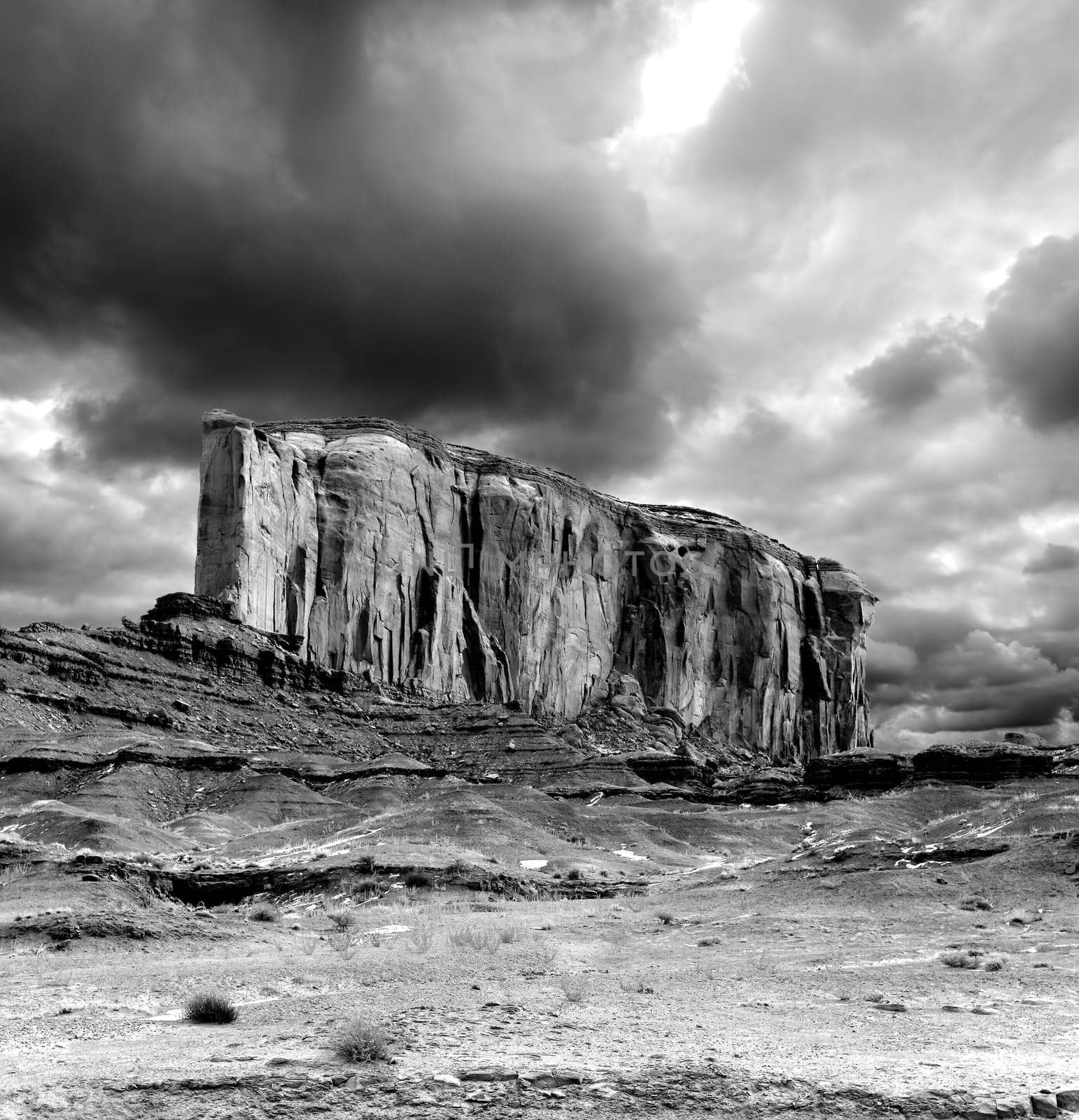 Monument Valley Arizona with stormy cloudy skies black and white
