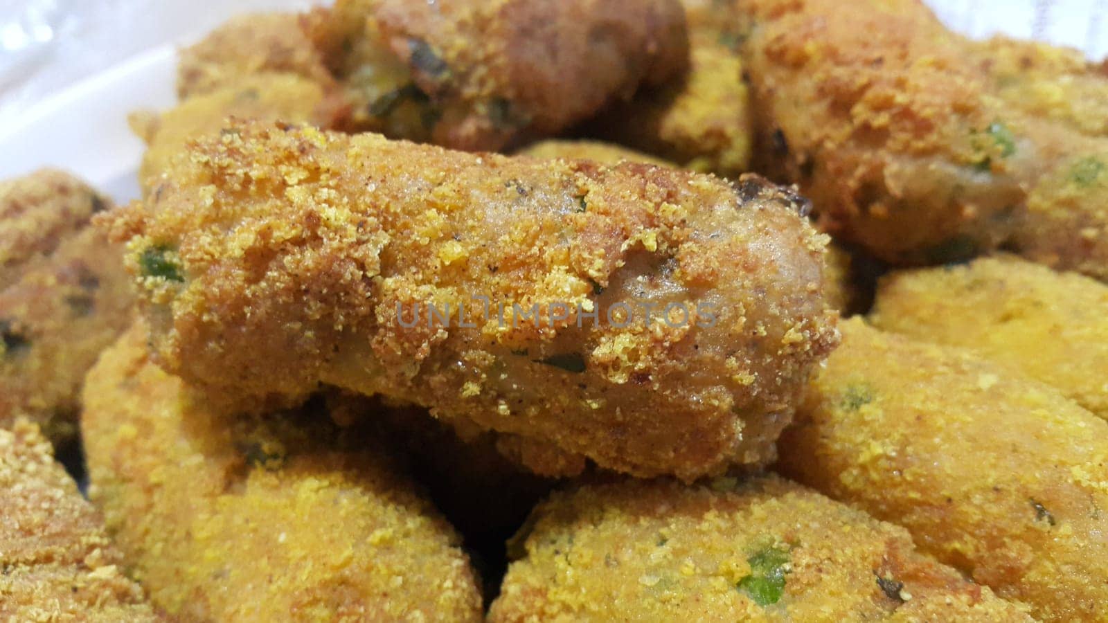 Closeup perspective view of home made spicy and delicious croquettes served with tea or other dishes during parties as fast food.