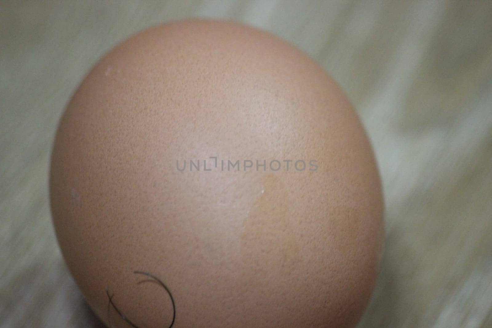 Closeup selective view of fresh farm chicken eggs isolated on a wooden background