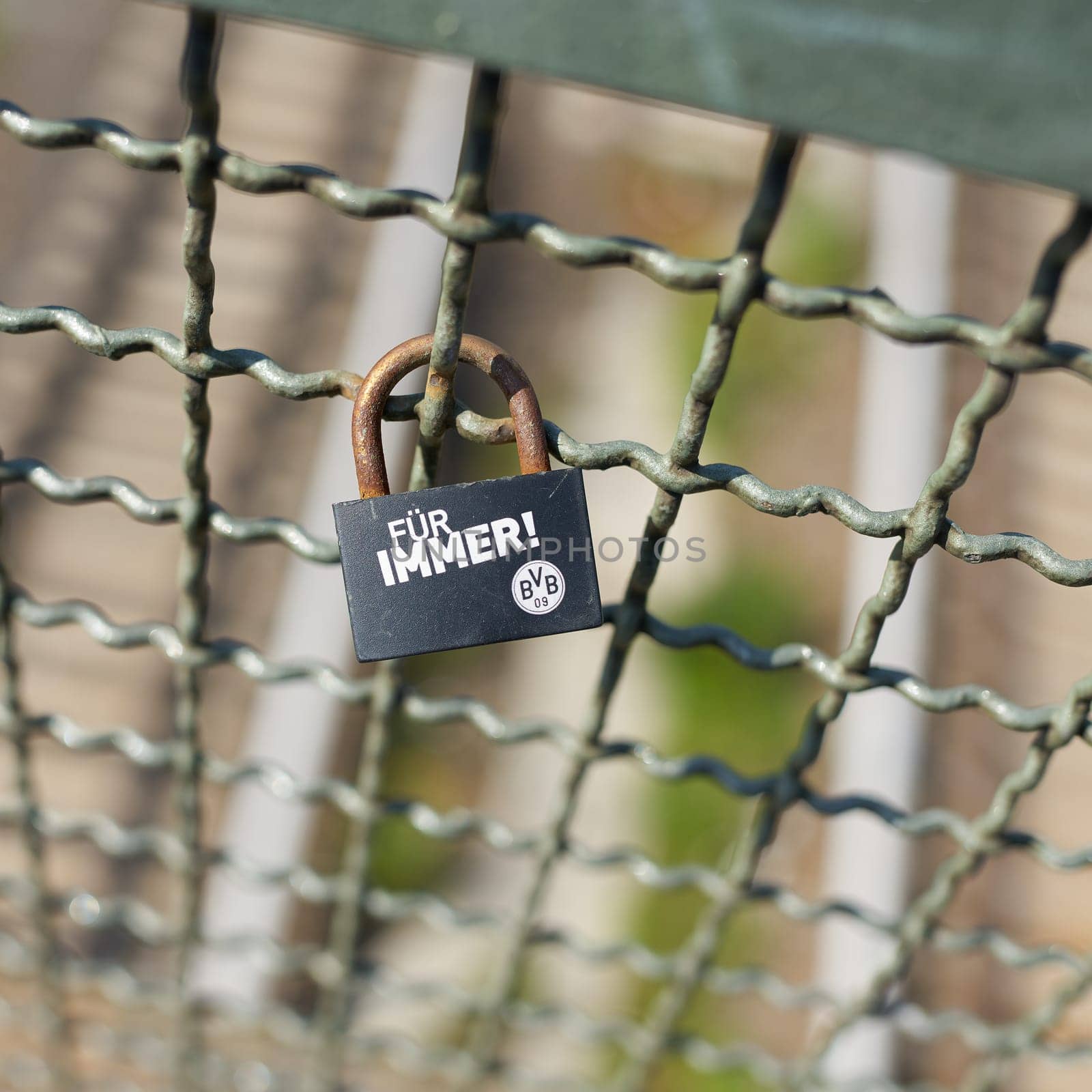 Expression of love to the soccer club Borussia Dortmund by a love lock on a bridge in Berlin