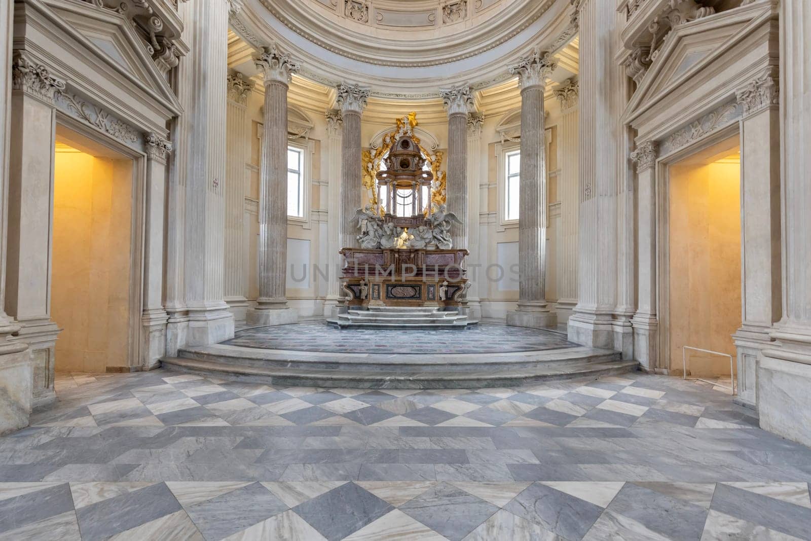 VENARIA REALE, ITALY - CIRCA MAY 2021: sacred catholic altar in Baroque style and cupola. Day light.