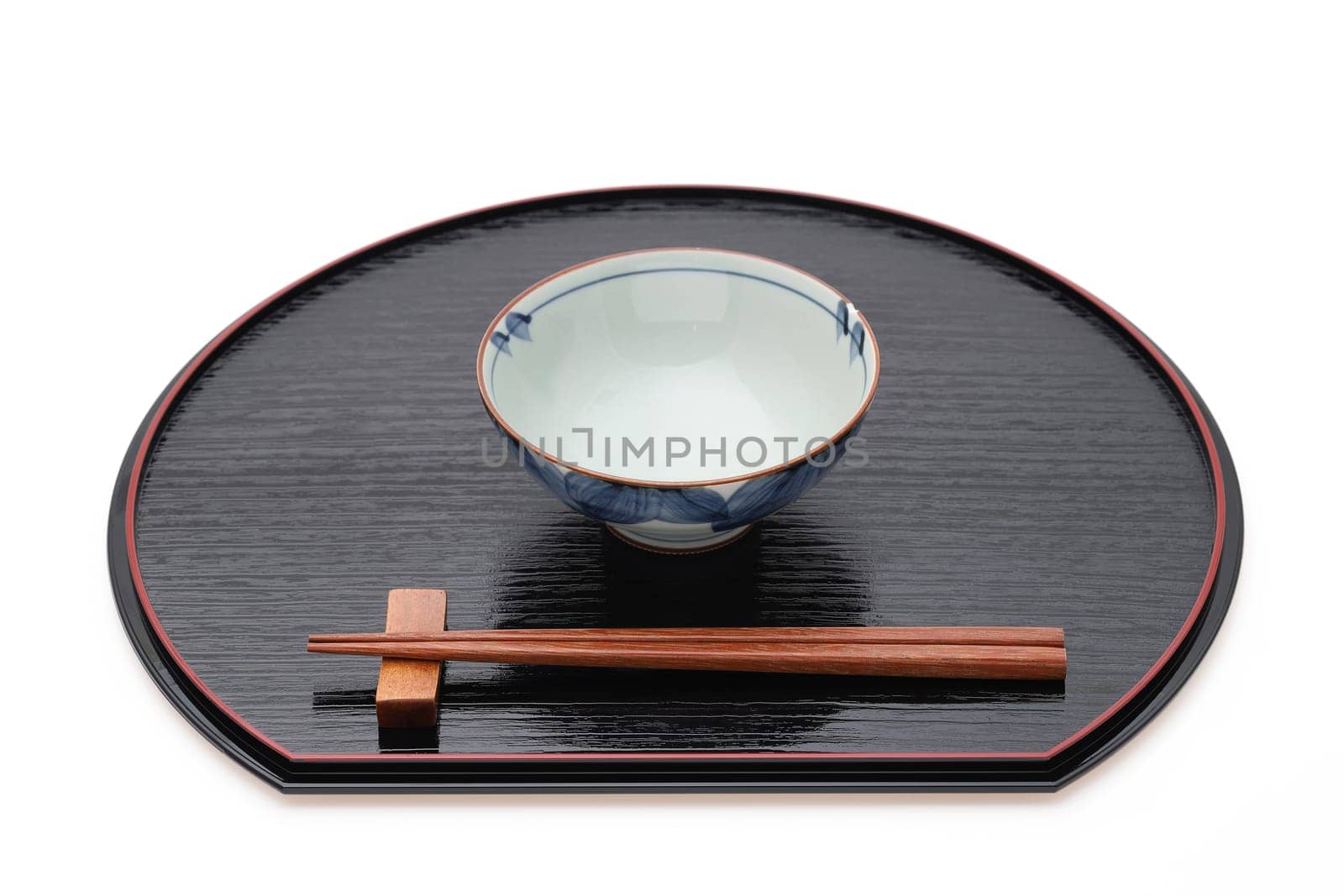 Rice bowl with chopsticks on tray, Traditional tableware of Japan. isolated on white background.