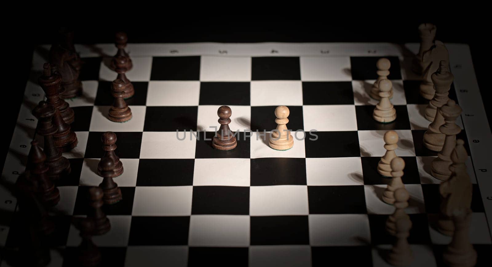 The Chess pieces on a chessboard. The concept of playing and winning a chess tournament