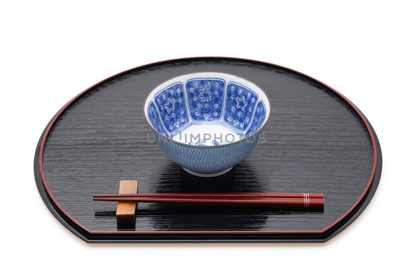 Rice bowl with chopsticks on tray, Traditional tableware of Japan. isolated on white background.