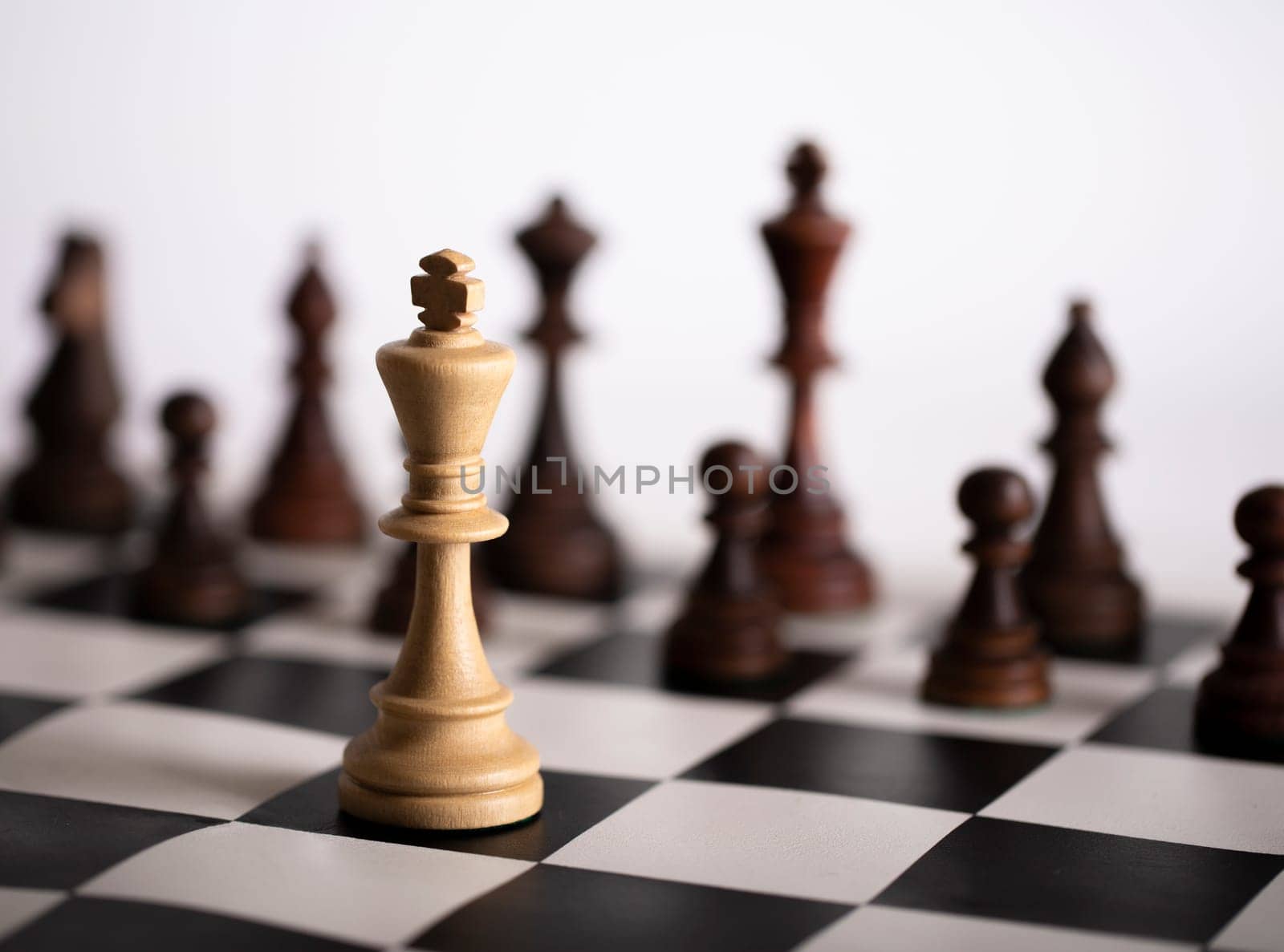 The Chess pieces on a chessboard. The concept of playing and winning a chess tournament