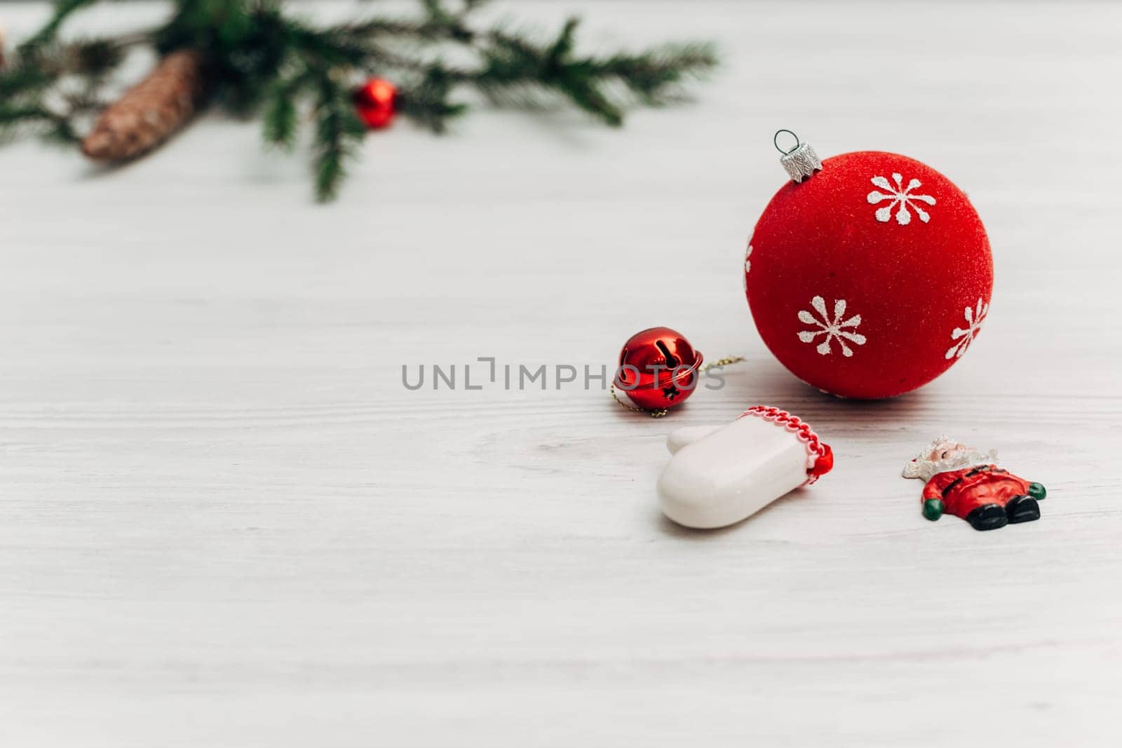 Christmas Decorations on a White Wooden Table with Copy Space Text