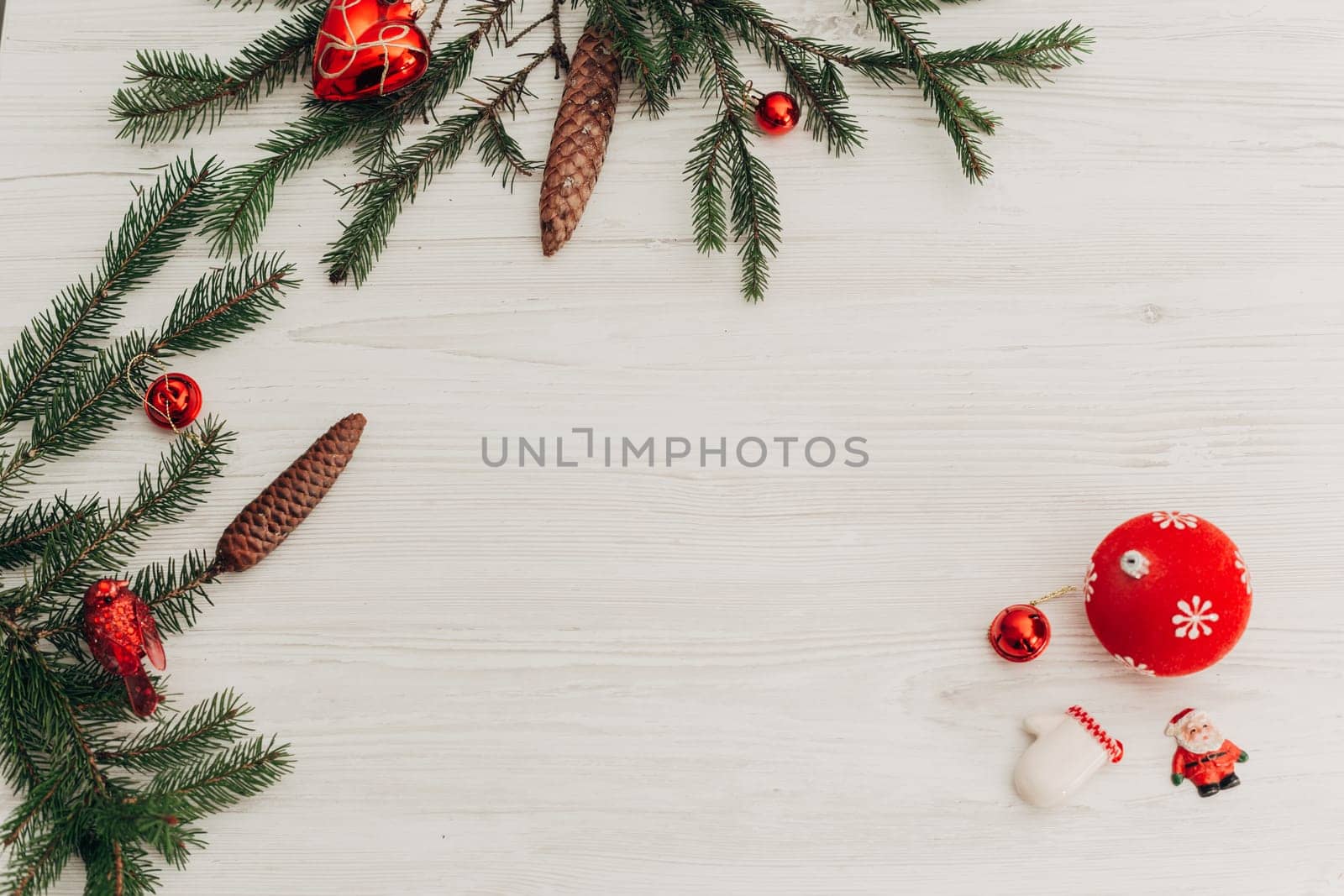 Christmas Decorations on a White Wooden Table with Copy Space Text
