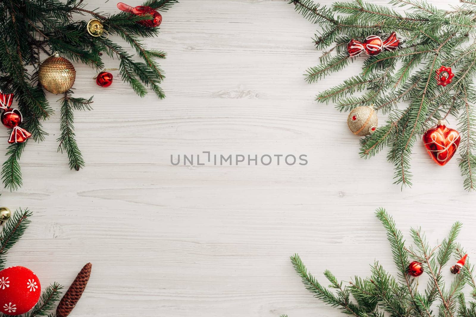Christmas Composition on a White Wooden Table with Copy Space Text
