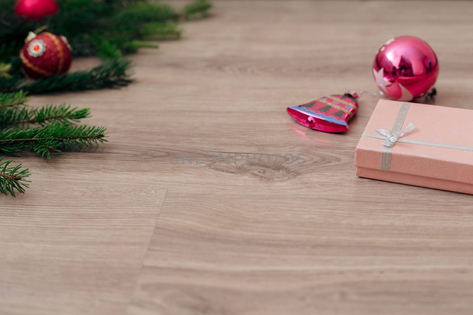 Decoration of Christmas Tree Green Branches on a Wooden Background with Copy Space