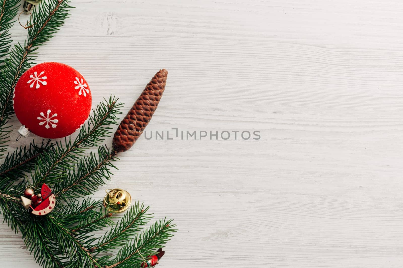 Christmas Red Decorations on a White Wooden Table with Copy Space Text