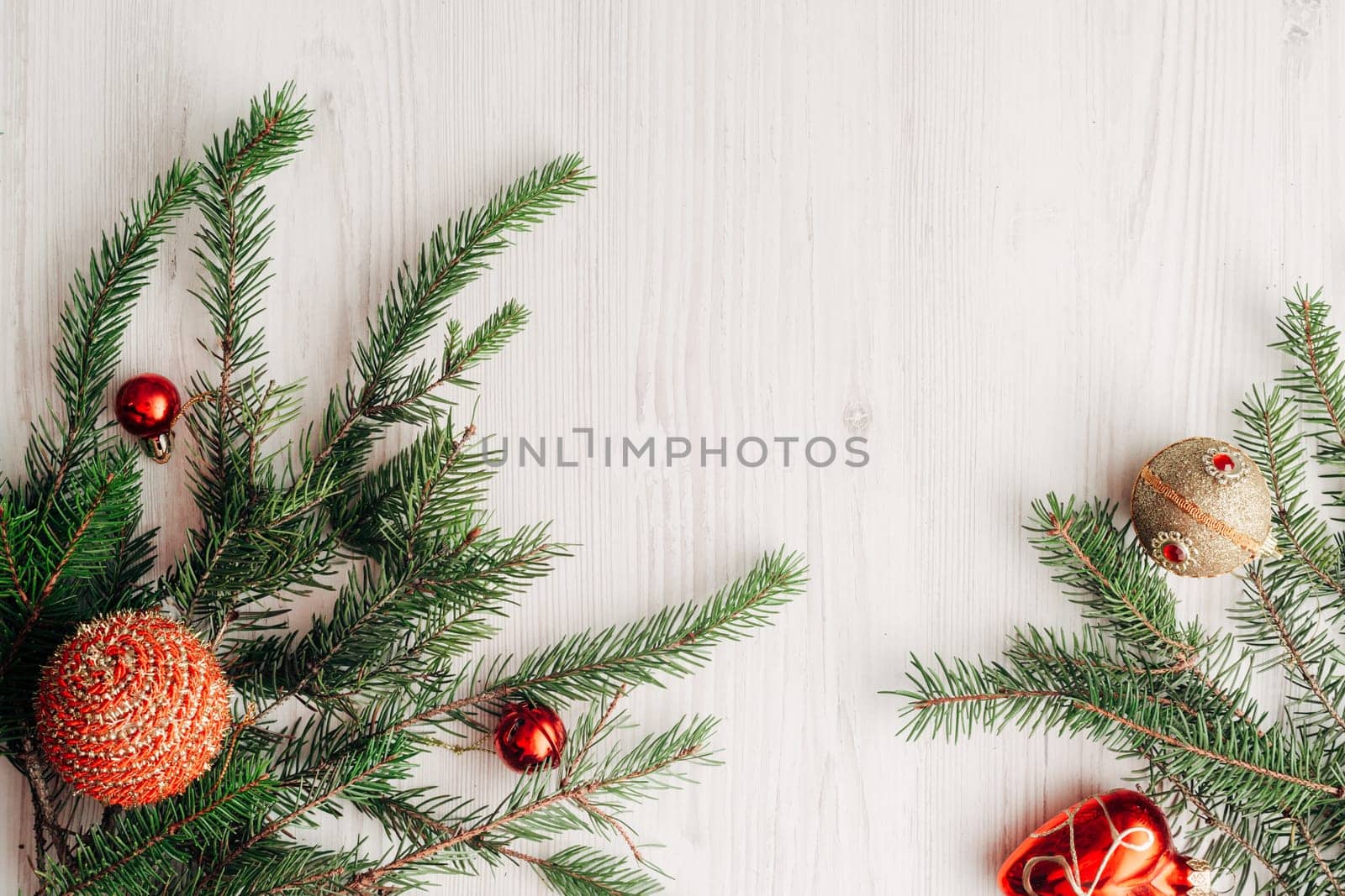 Christmas Composition on a White Wooden Table with Copy Space Text