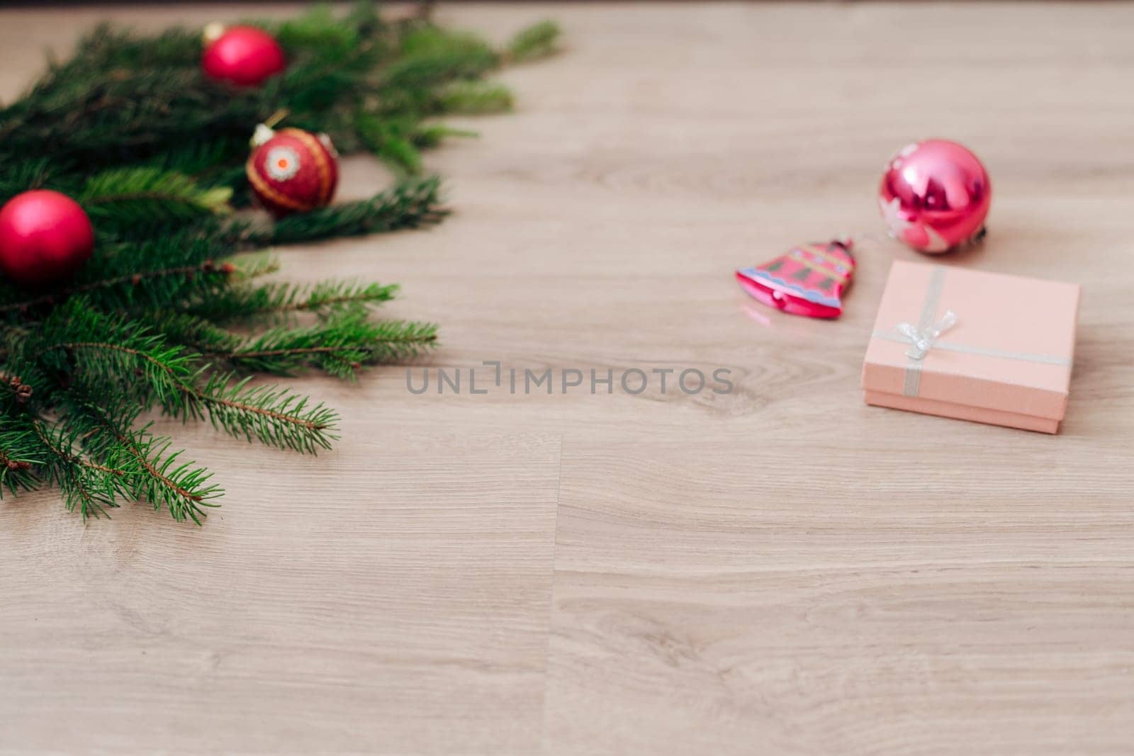 Decoration of Christmas Tree Green Branches on a Wooden Background with Copy Space