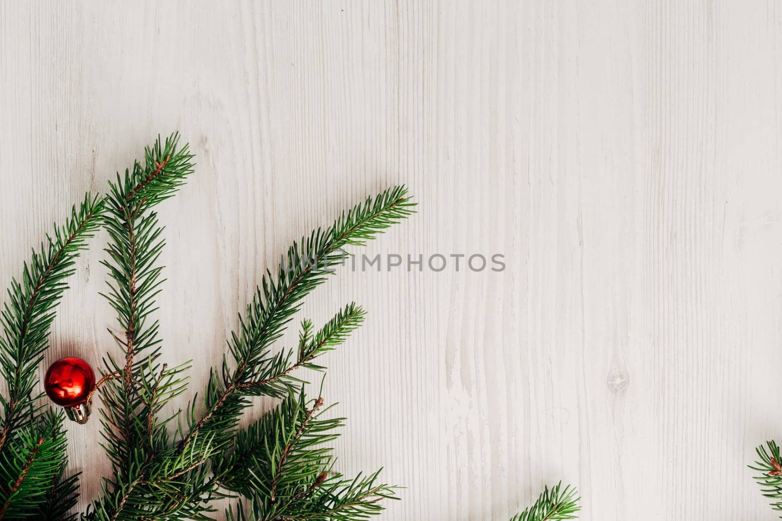 Christmas Composition on a White Wooden Table with Copy Space Text
