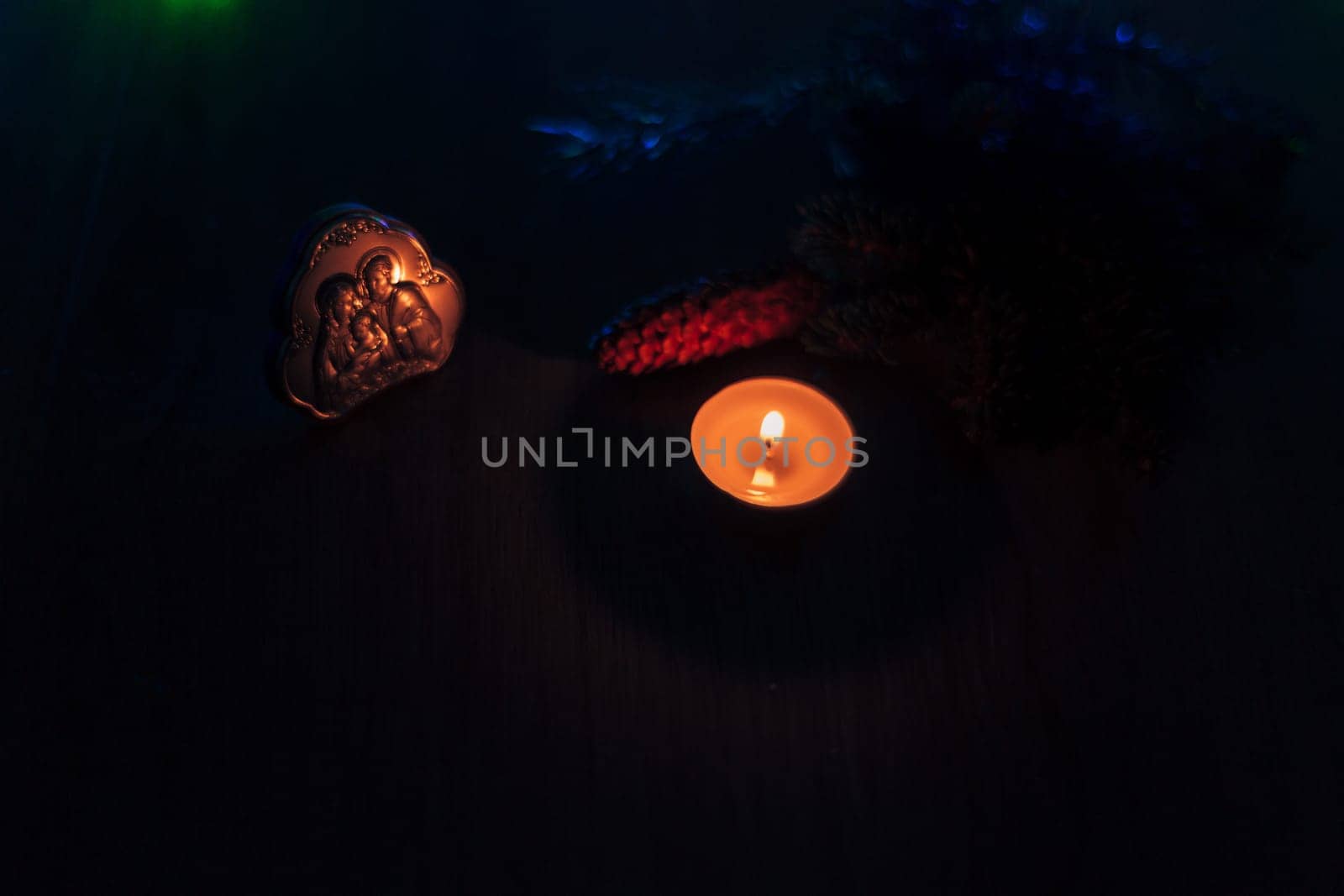 Christmas Composition of Church Icon on a Wooden Background With Multicolored Light Boken
