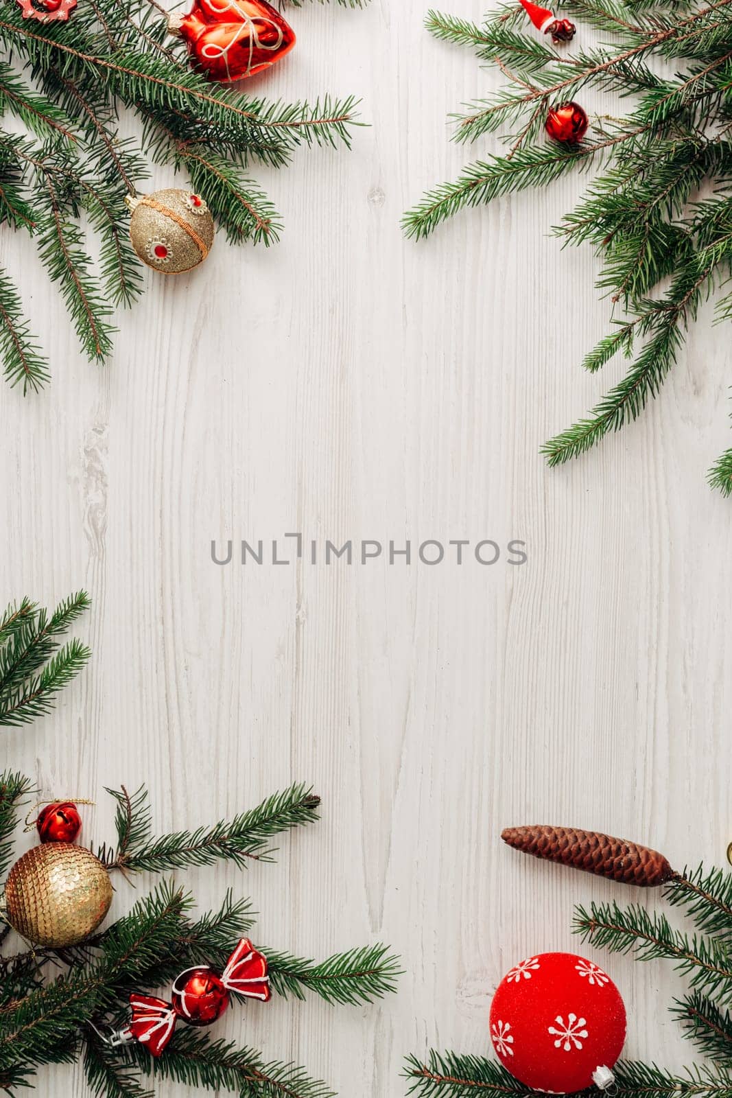 Christmas Composition on a White Wooden Table with Copy Space Text