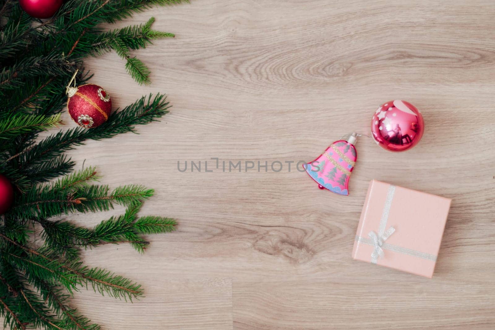 Decoration of Christmas Tree Green Branches on a Wooden Background with Copy Space