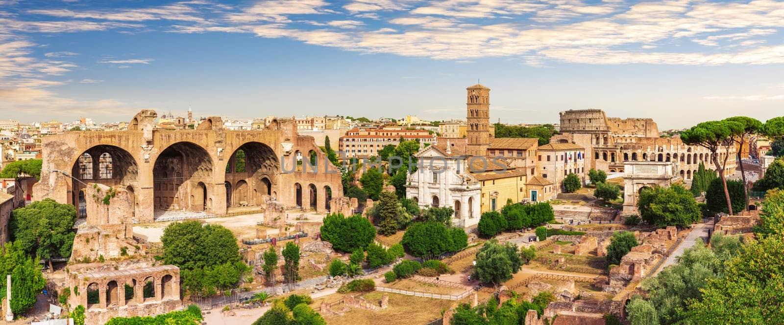 Roman Forum full panorama, view of the Basilica of Maxentius and Constantine, House of the Vestals and the Coliseum, Italy.