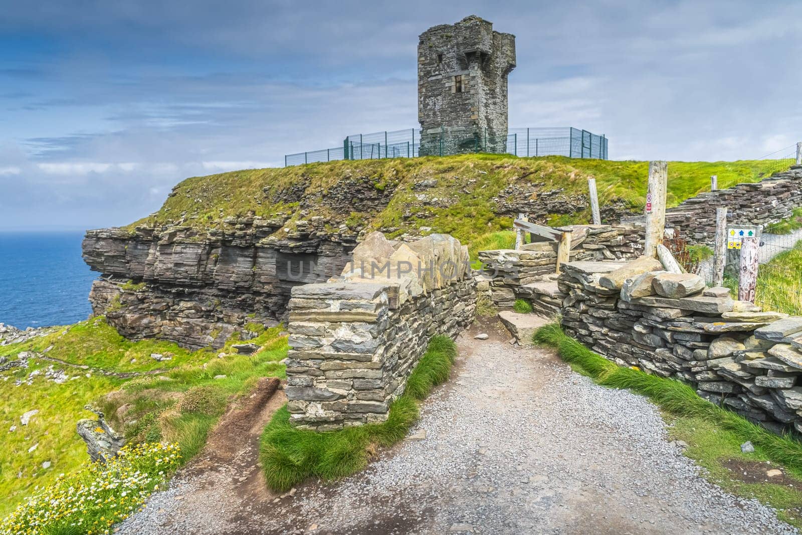 Old Moher Tower on Hags Head, watchtower at the southern end of Cliffs of Moher, popular tourist attraction, Wild Atlantic Way, County Clare, Ireland