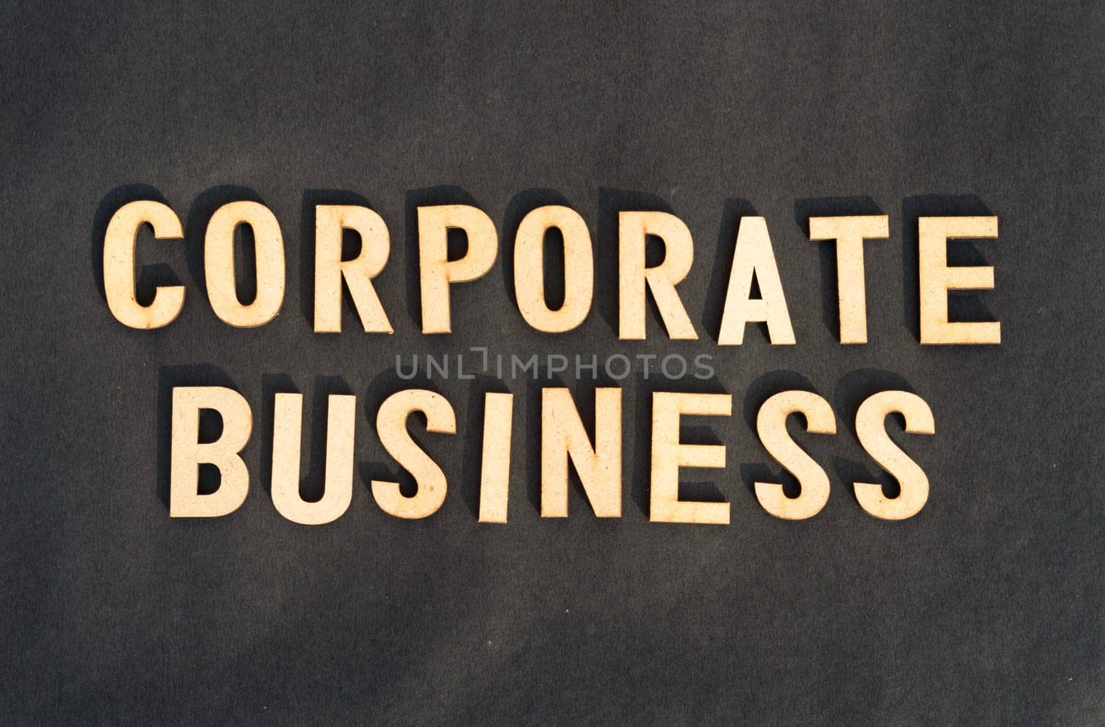 Corporate word and business concept. Wooden cubes words Corporate Business isolated on black background. Business Finance Industry concept.