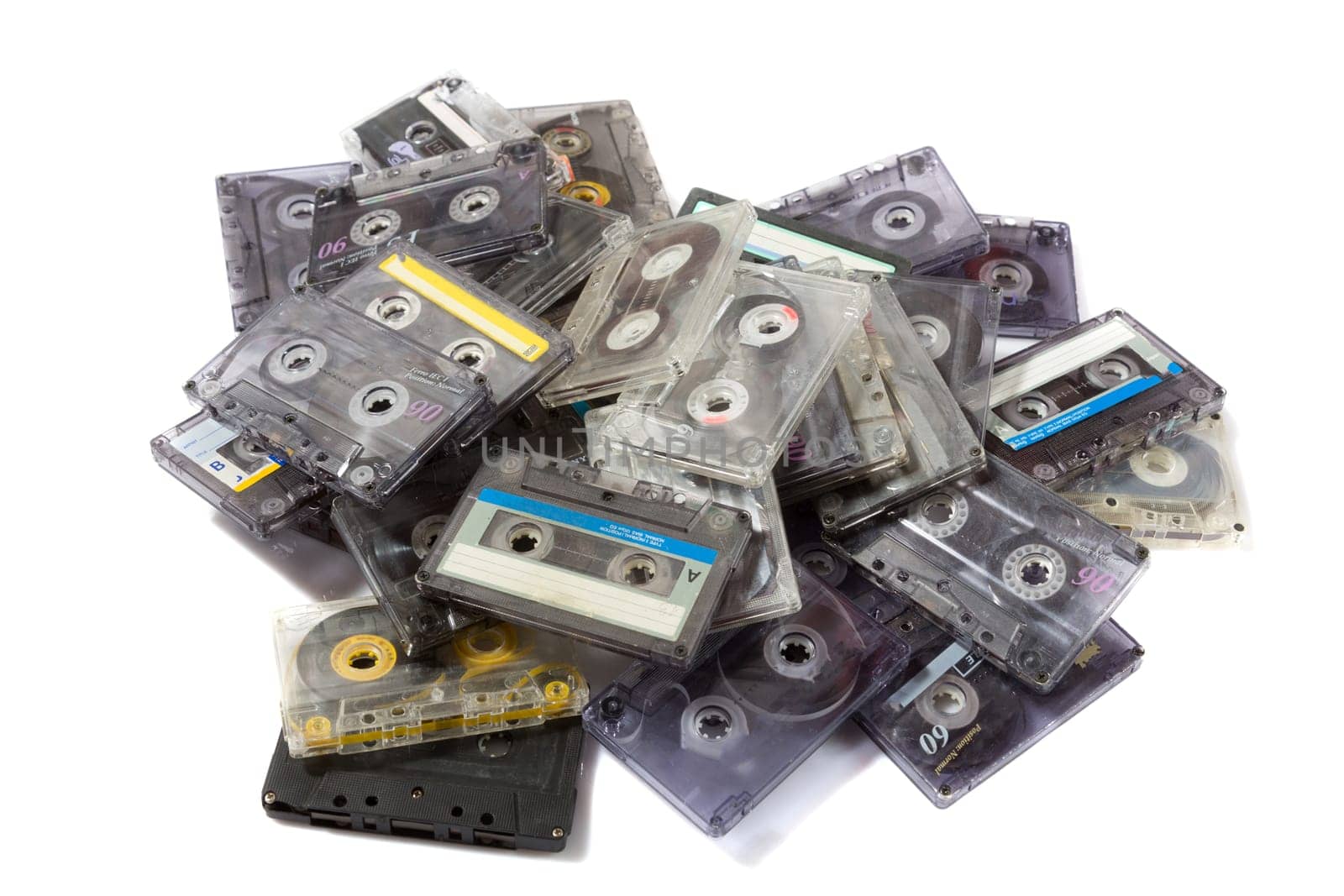pile of audio compact cassettes on a white background